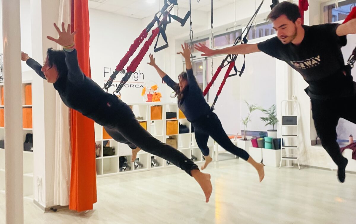 Persons jumping with bungee fitness