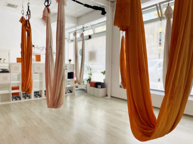 aerial yoga studio with orange silk